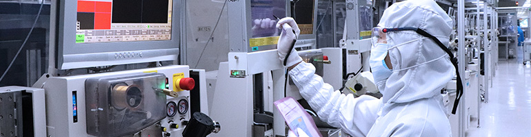 Worker in back-end manufacturing.