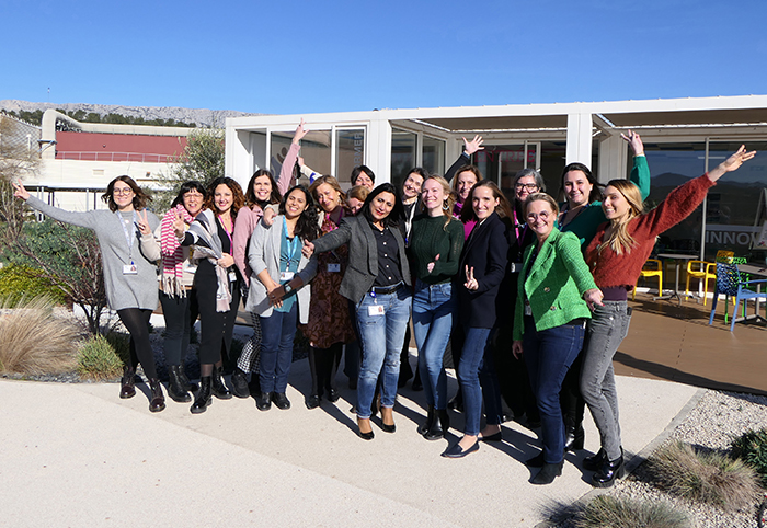 A group of women posing outdoors for the group shot